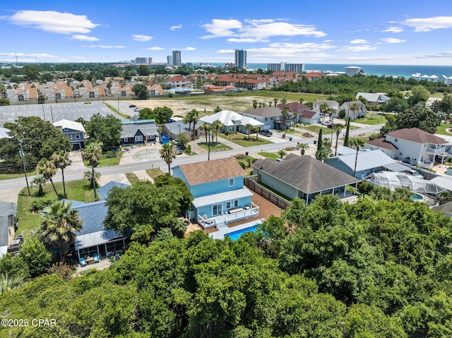 birds eye view of property with a water view