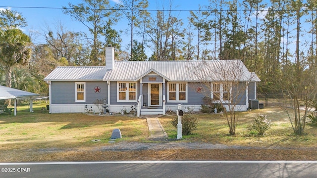 view of front of house featuring a front yard and central air condition unit