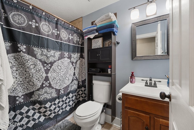 bathroom with vanity, a textured ceiling, curtained shower, and toilet