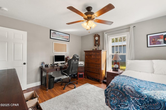 bedroom with ceiling fan and light wood-type flooring