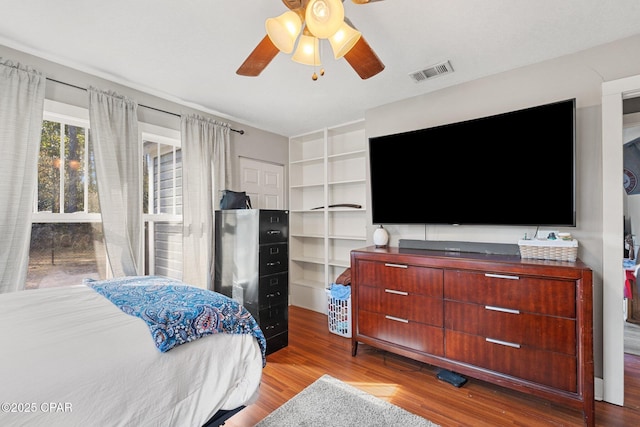 bedroom with ceiling fan and light wood-type flooring