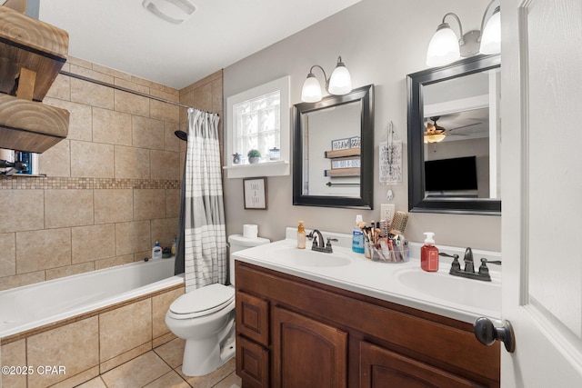 full bathroom with shower / tub combo with curtain, tile patterned flooring, vanity, ceiling fan, and toilet