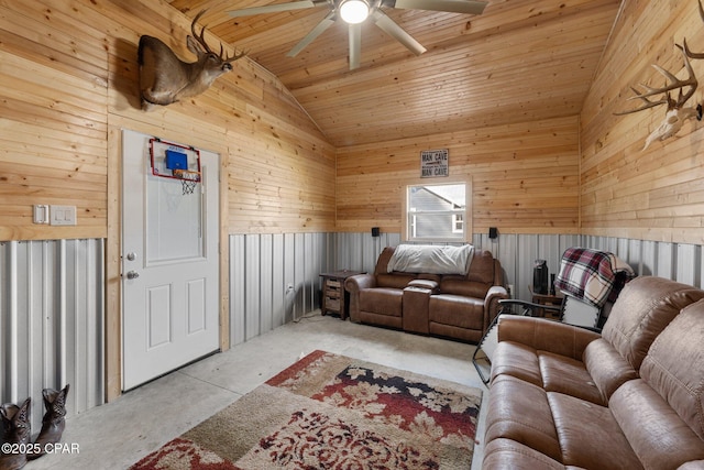 living room with lofted ceiling, wooden ceiling, ceiling fan, and wood walls