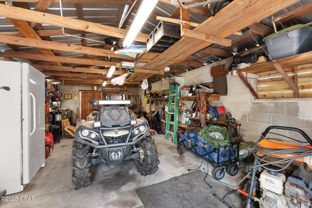 garage with white refrigerator