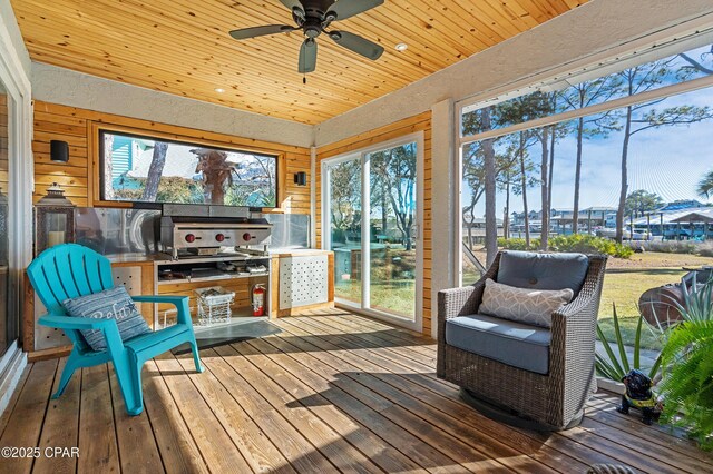 bedroom with multiple windows, light hardwood / wood-style floors, and ceiling fan