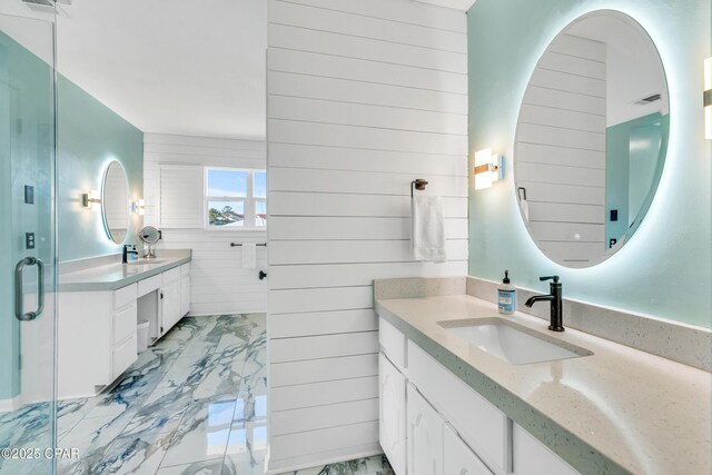 bathroom with vanity, washer / clothes dryer, and toilet