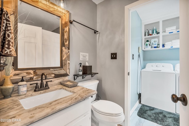 bathroom featuring toilet and vanity