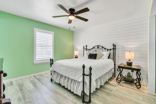 bedroom featuring ceiling fan and light hardwood / wood-style flooring