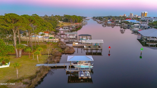 aerial view at dusk with a water view