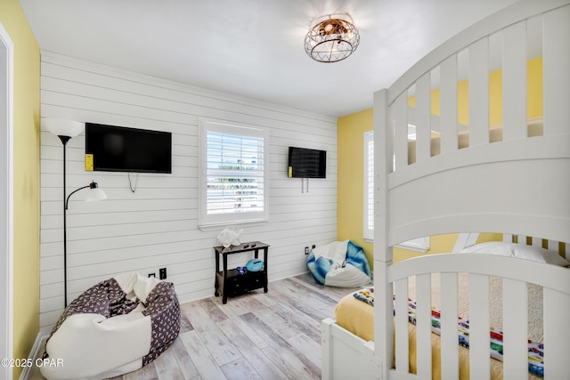 bedroom with wood finished floors