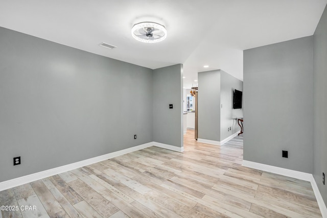 empty room with visible vents, recessed lighting, baseboards, and light wood-type flooring