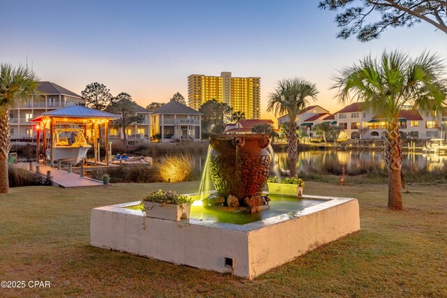 view of dock with a water view and a lanai