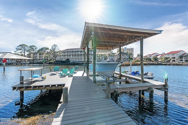 view of dock featuring a water view and boat lift