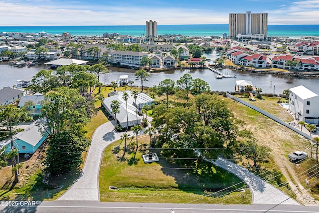 birds eye view of property with a water view