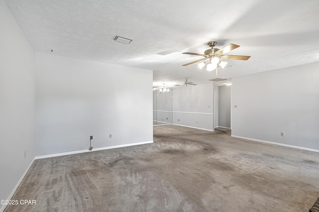 carpeted spare room with ceiling fan with notable chandelier and a textured ceiling