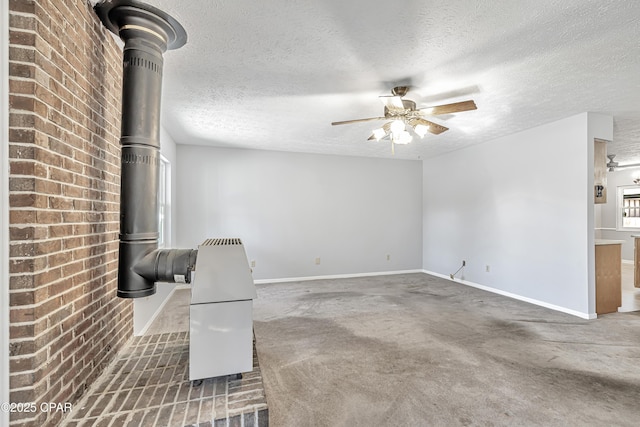 carpeted living room featuring ceiling fan, a textured ceiling, and a wood stove