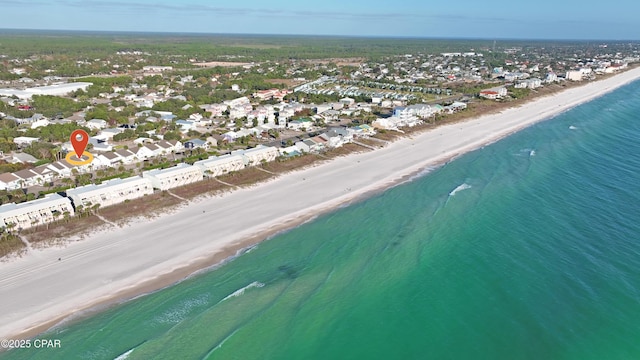 drone / aerial view featuring a water view and a view of the beach