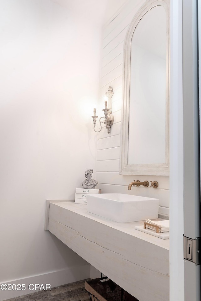 bathroom with vanity and baseboards