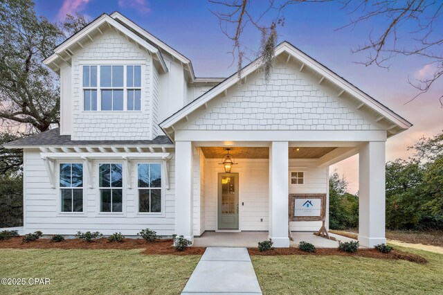 view of front facade with a garage and a front lawn