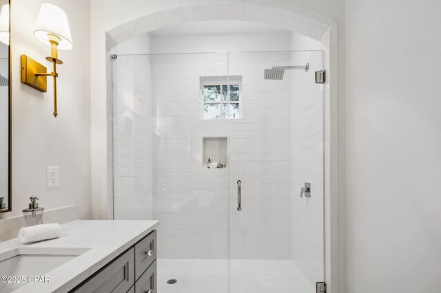 full bathroom featuring a stall shower and vanity