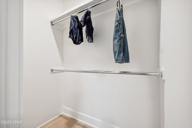 walk in closet featuring light wood finished floors