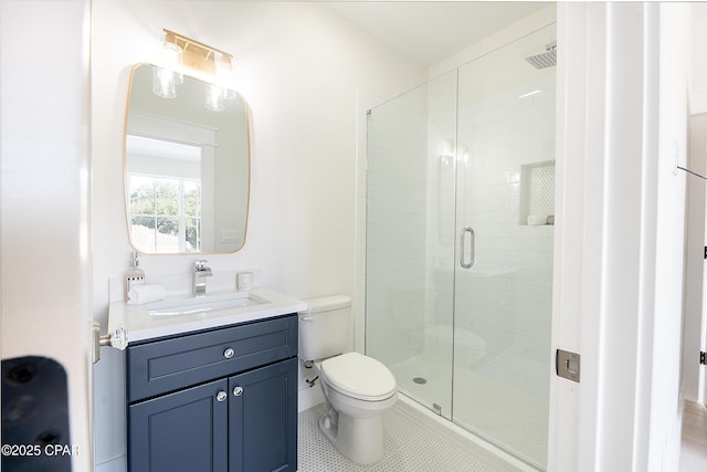 bathroom with a stall shower, tile patterned flooring, vanity, and toilet