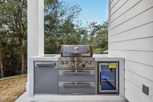 view of patio with exterior kitchen and wine cooler