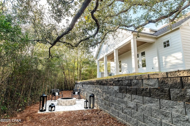 exterior space with a patio area and a fire pit