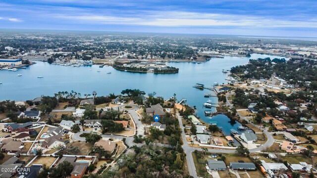 drone / aerial view with a residential view and a water view