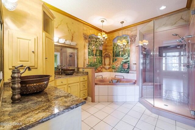 bathroom featuring vanity, tile patterned flooring, crown molding, and shower with separate bathtub