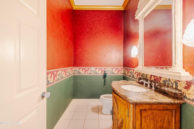 bathroom with tile patterned flooring, vanity, and toilet