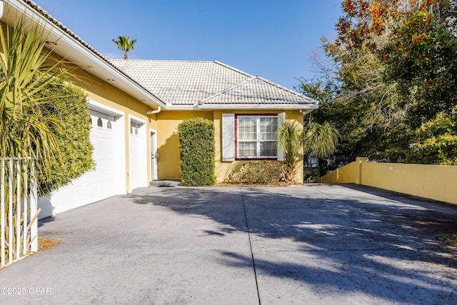 view of side of property featuring a garage