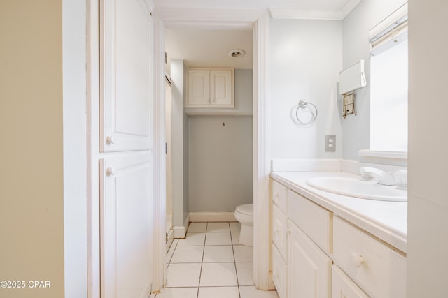 bathroom featuring vanity, toilet, and tile patterned flooring