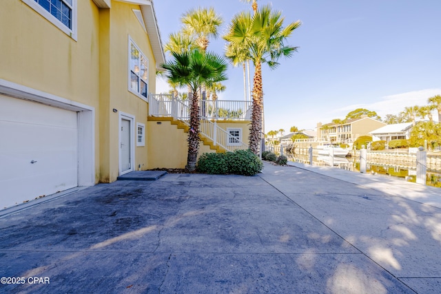 view of side of home featuring a garage