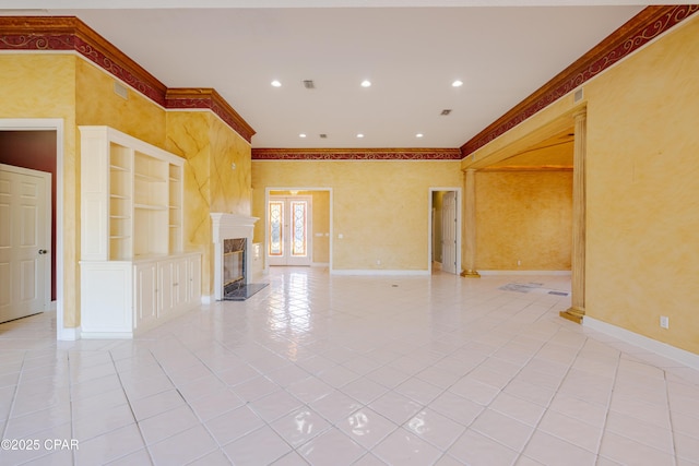 unfurnished living room with light tile patterned floors, built in shelves, a fireplace, and ornamental molding