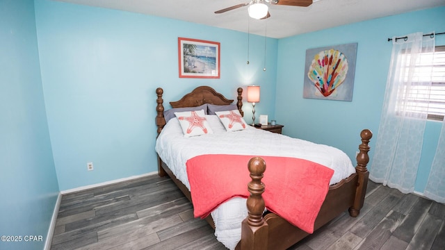 bedroom featuring dark hardwood / wood-style floors and ceiling fan