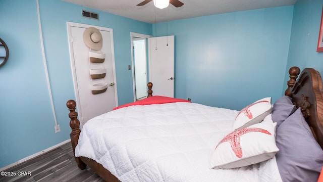 bedroom featuring ceiling fan and dark hardwood / wood-style flooring