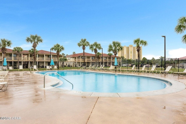 view of swimming pool featuring a patio