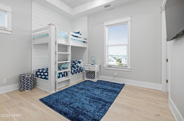 bedroom with hardwood / wood-style flooring