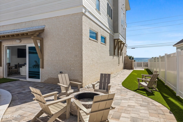 view of patio / terrace with a fire pit