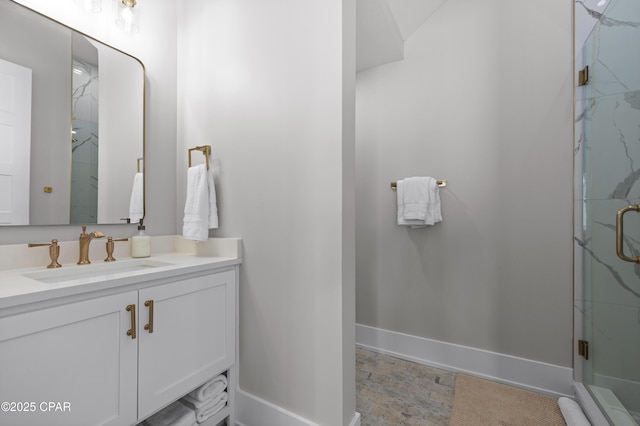 bathroom with an enclosed shower and vanity