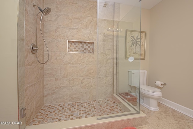 bathroom featuring an enclosed shower, tile patterned floors, and toilet