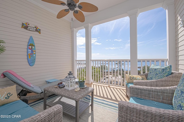 exterior space with a water view, an outdoor hangout area, and ceiling fan