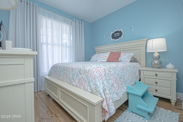 bedroom with light hardwood / wood-style flooring