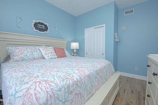 bedroom with a closet and light wood-type flooring