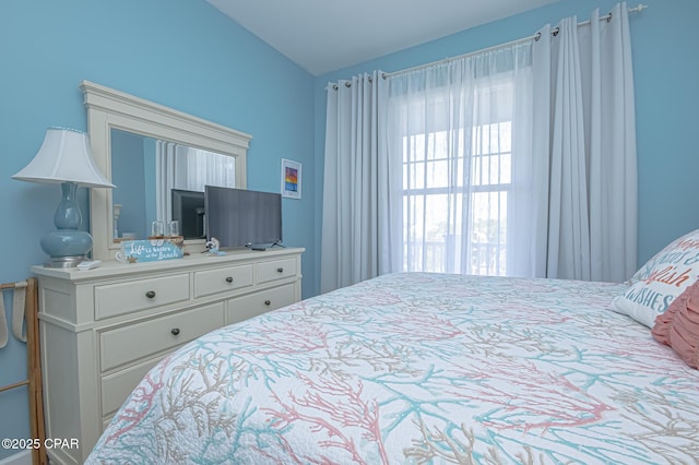 bedroom with vaulted ceiling