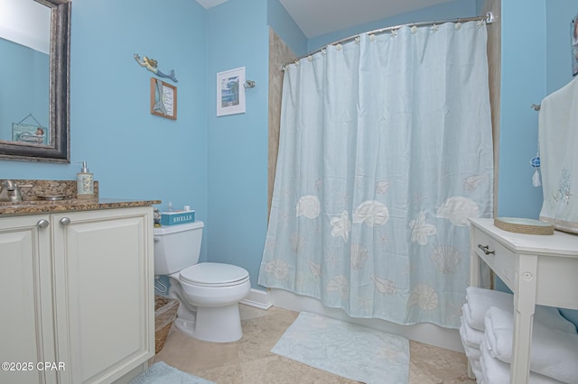 bathroom with vanity, tile patterned floors, and toilet