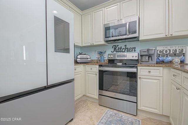 kitchen with stone counters and appliances with stainless steel finishes