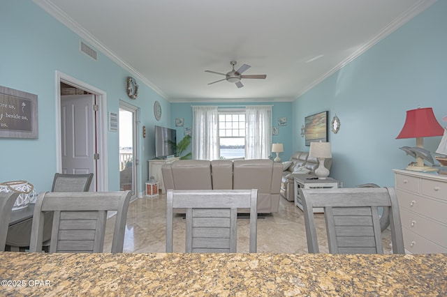 bedroom with ornamental molding and ceiling fan