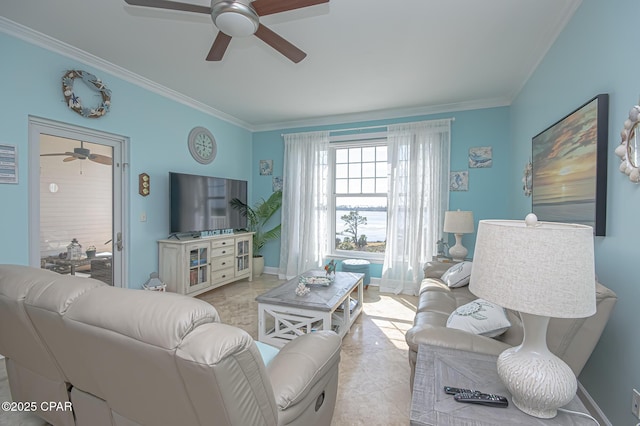 tiled living room with ornamental molding and ceiling fan